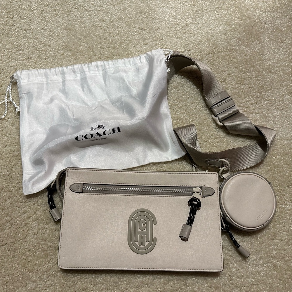 Coach Men’s Rivington Pouch 
Item # C0947
Original price $275
Color: Chalk/Bone - Picture 2 of 5